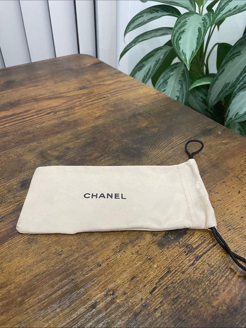 CHANEL Beige Suede Drawstring Pouch with Black Logo